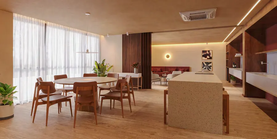 Espaço gourmet e wine bar do Astra Ilha Pura com mesa de jantar e cozinha
